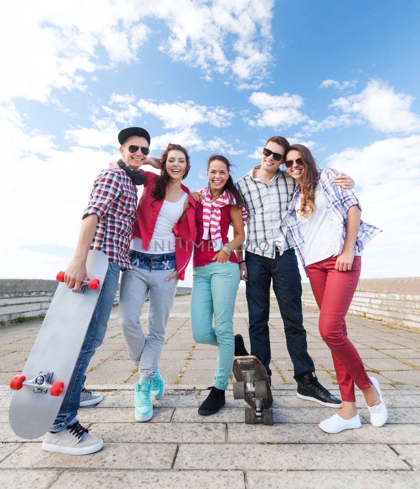 teenagers with skates outside by dolgachov