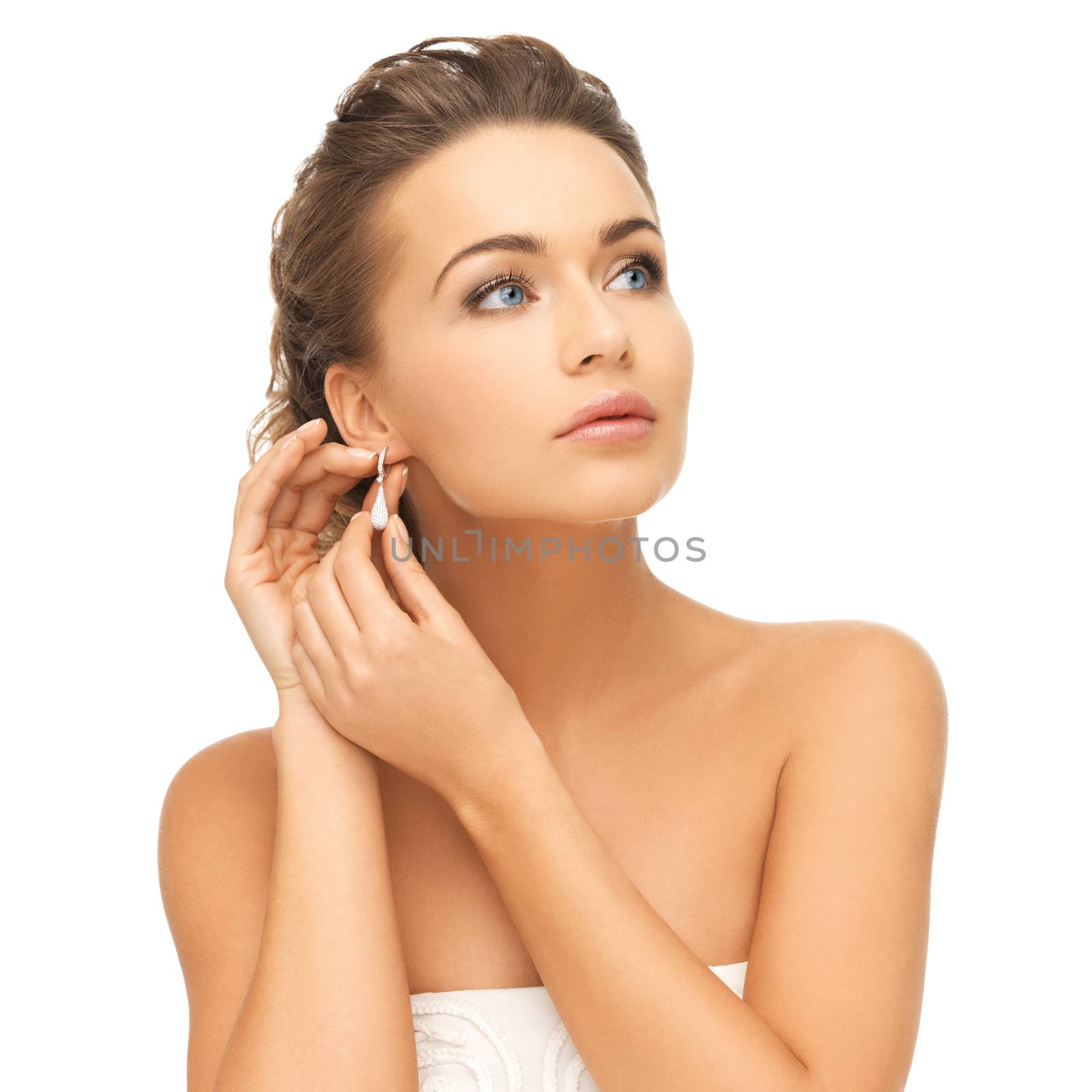 beauty and jewelry concept - beautiful woman wearing shiny diamond earrings