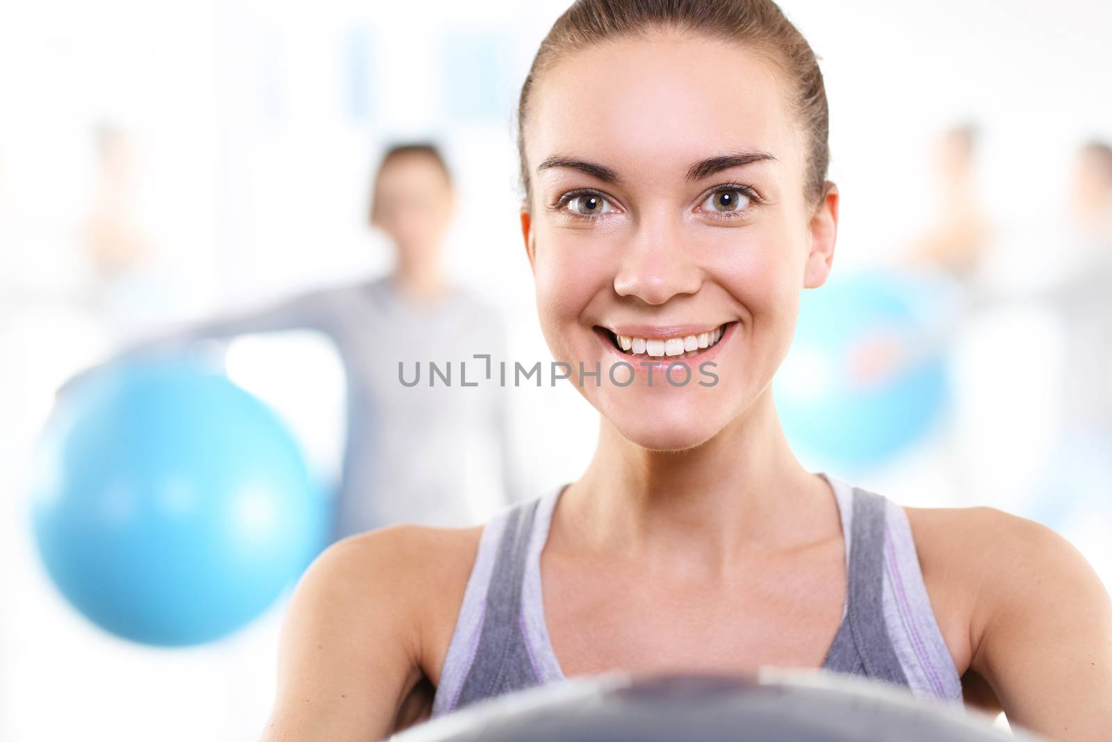 A group of women exercising on a mat with ball by robert_przybysz