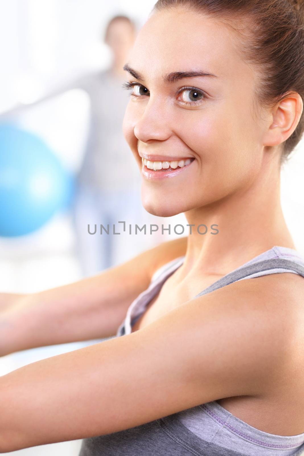 A group of women exercising on a mat with ball