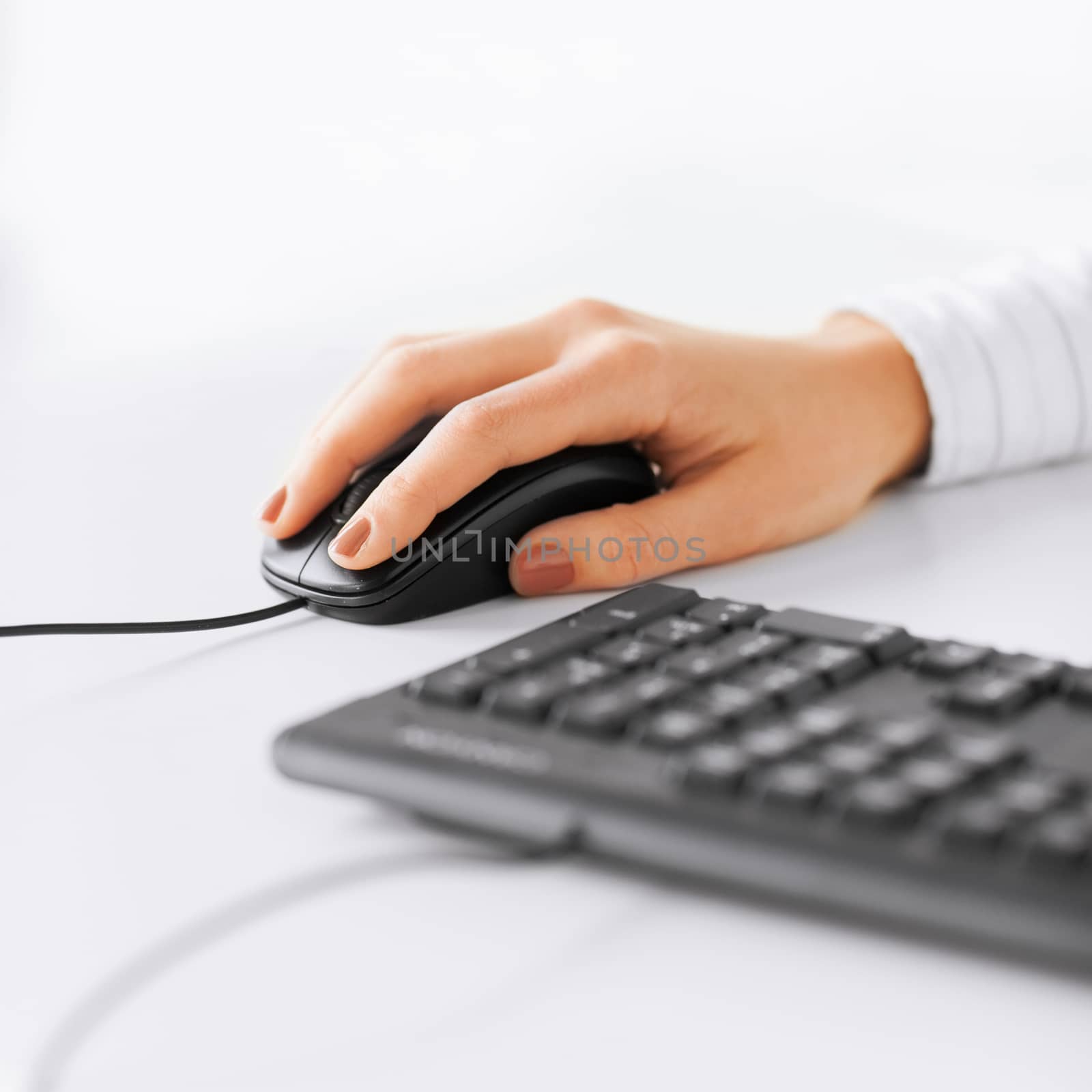 woman hands with keyboard and mouse by dolgachov