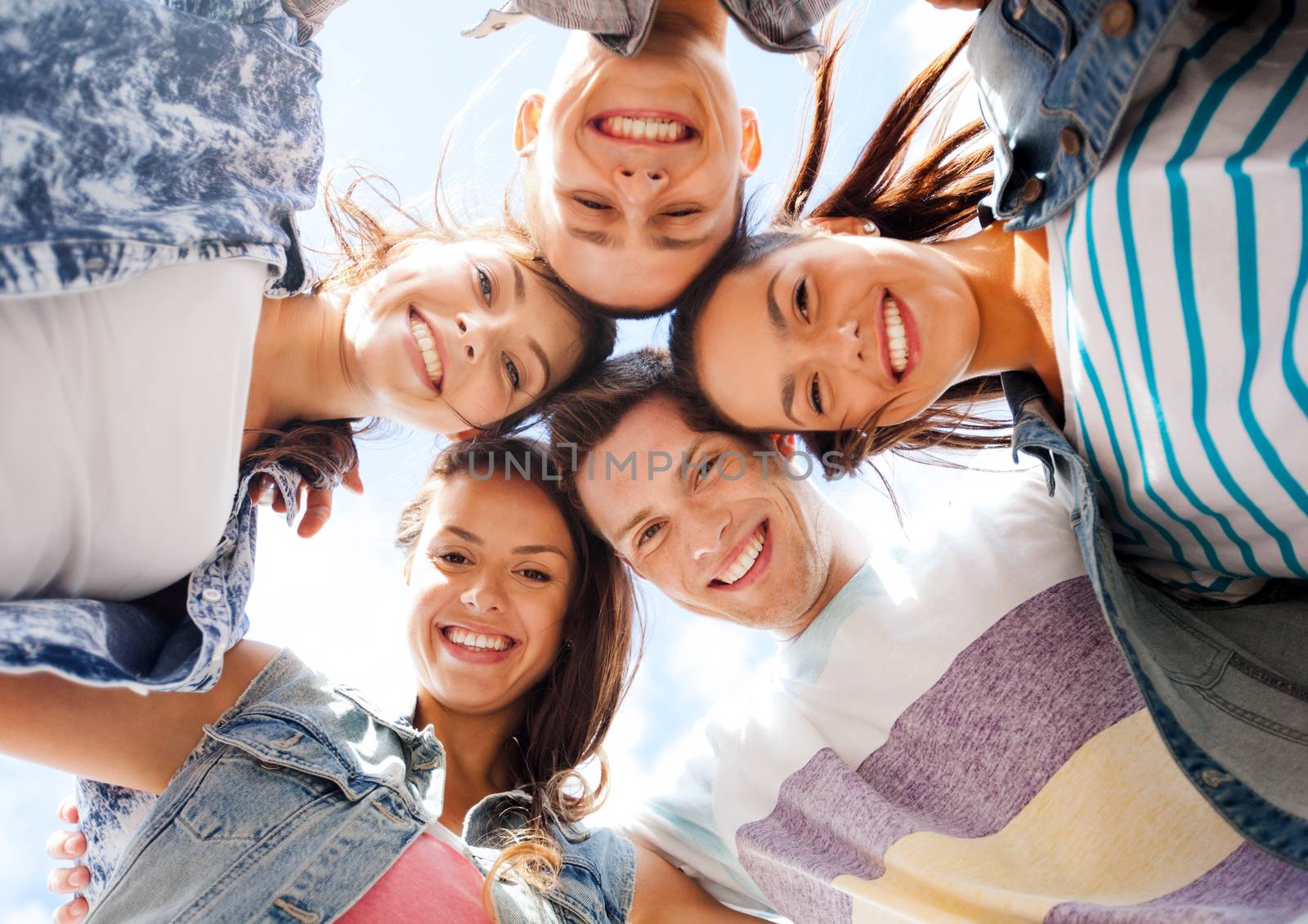 group of teenagers looking down by dolgachov