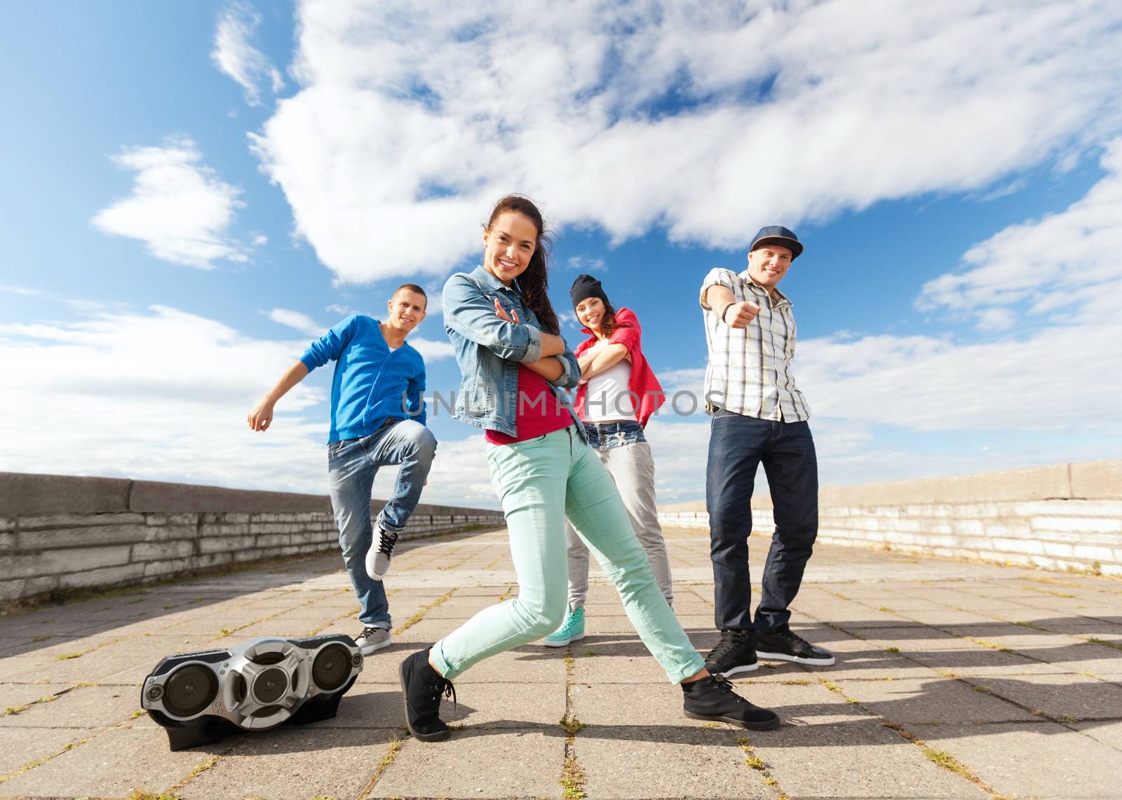 group of teenagers dancing by dolgachov