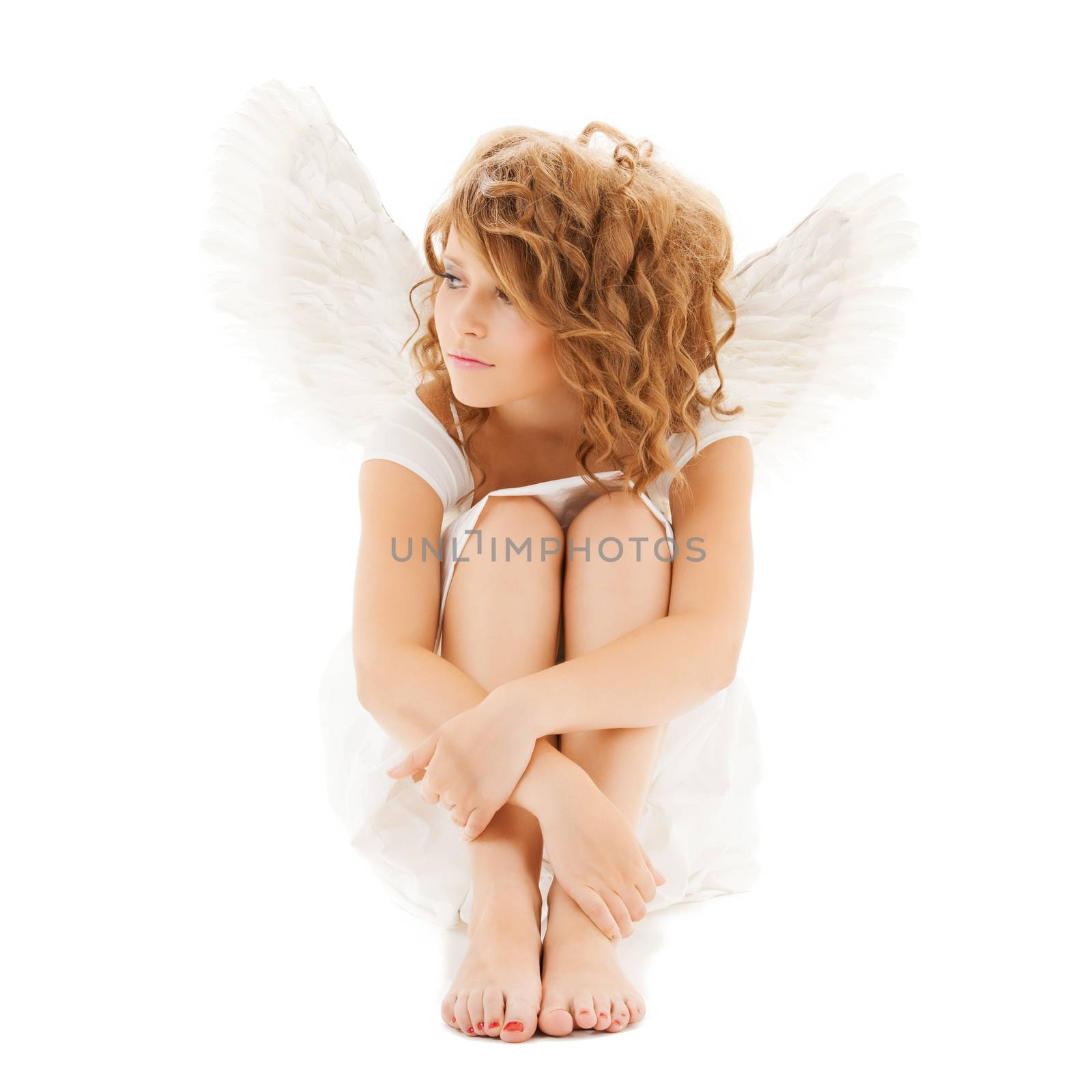 holidays and costumes concept - sad teenage angel girl