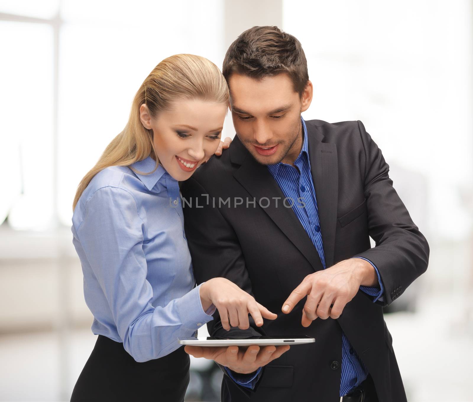 man and woman with tablet pc by dolgachov