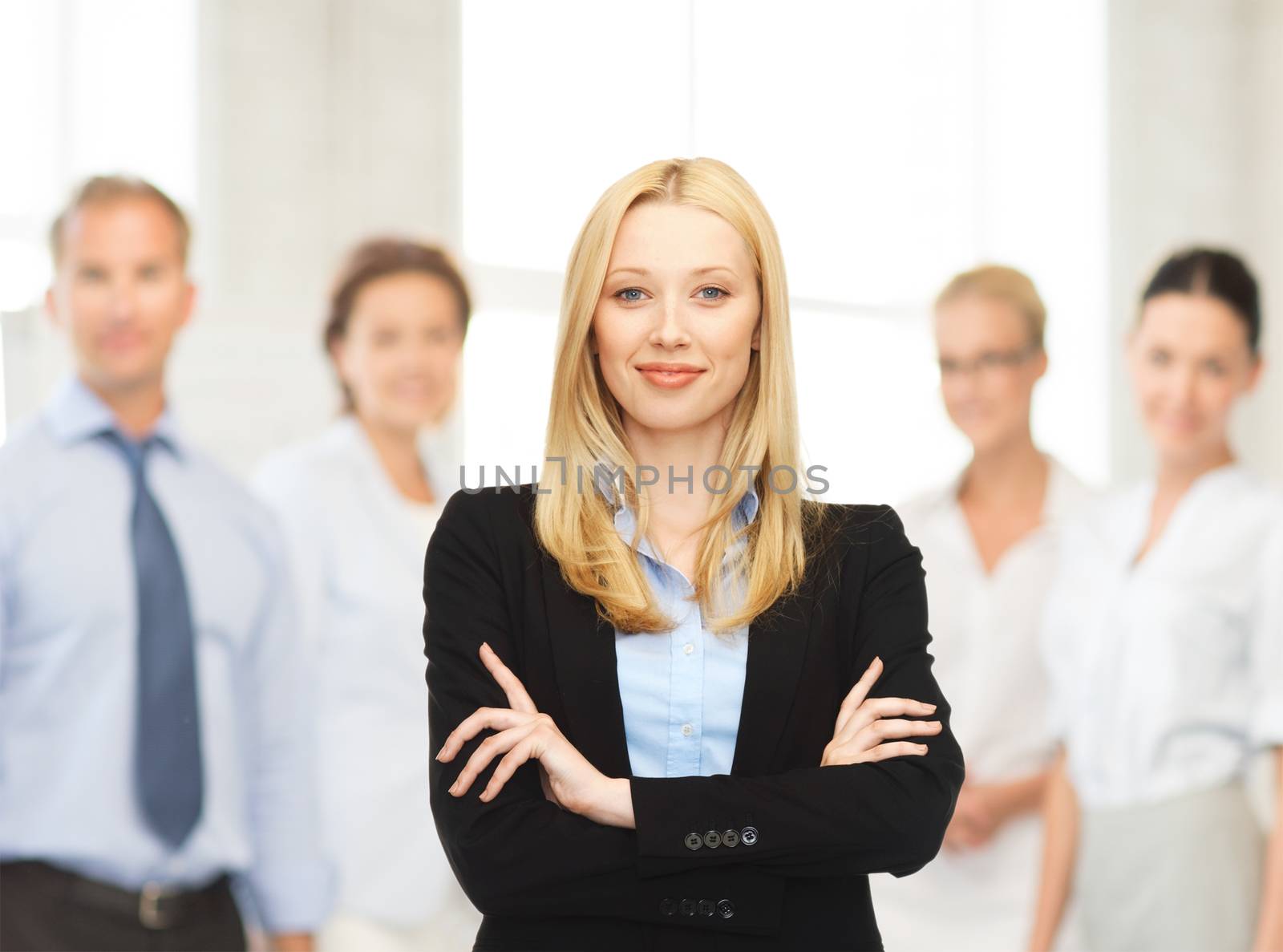 office, buisness, teamwork concept - friendly young smiling businesswoman