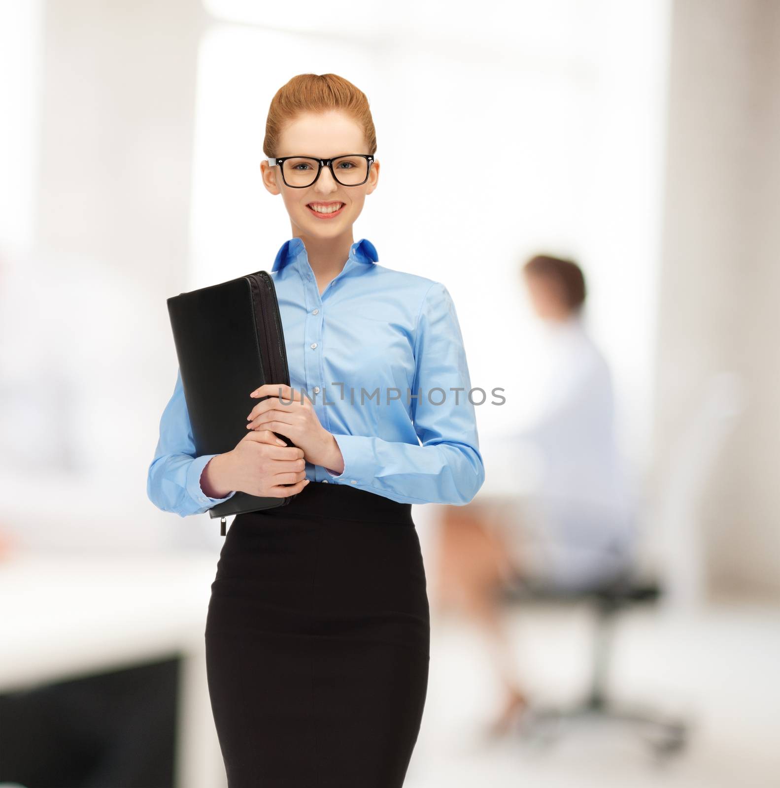 office, buisness, education concept - young smiling woman with folder