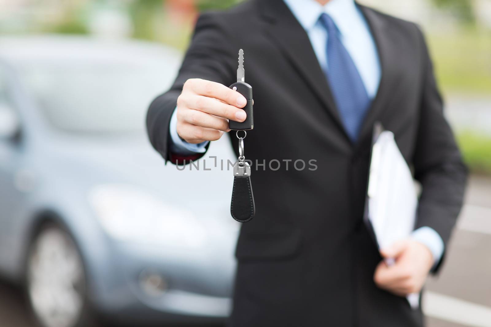 man with car key outside by dolgachov