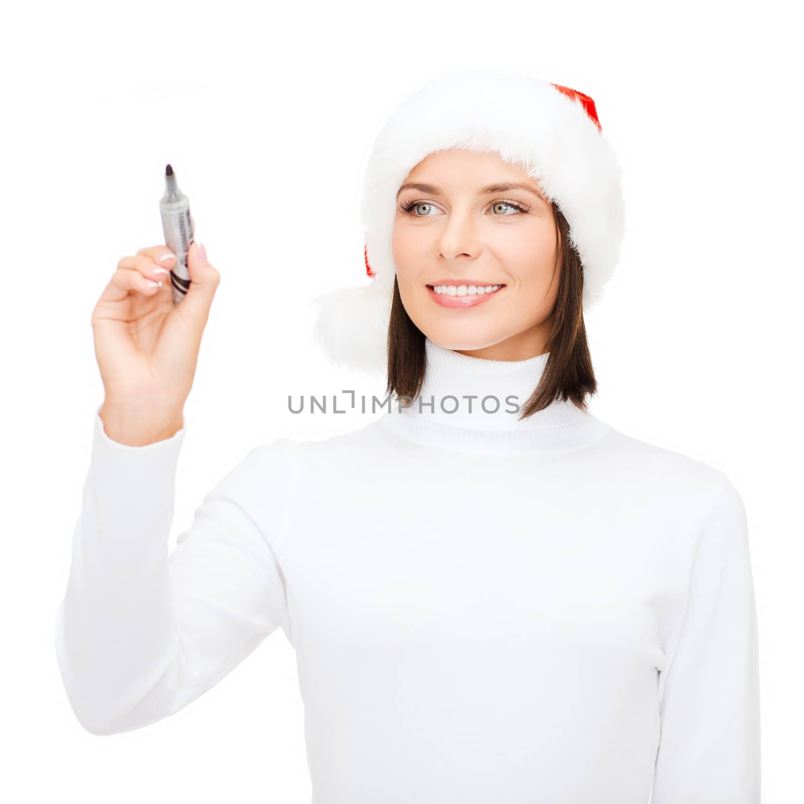 christmas, x-mas, winter, happiness concept - smiling woman in santa helper hat drawing or writing something in the air