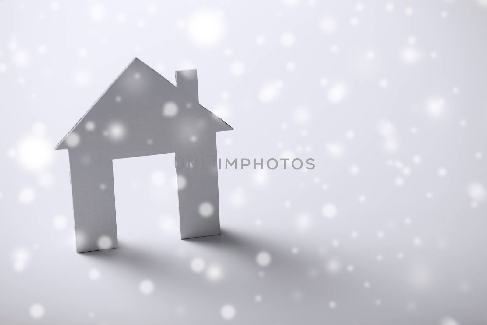 white paper house over white background by dolgachov