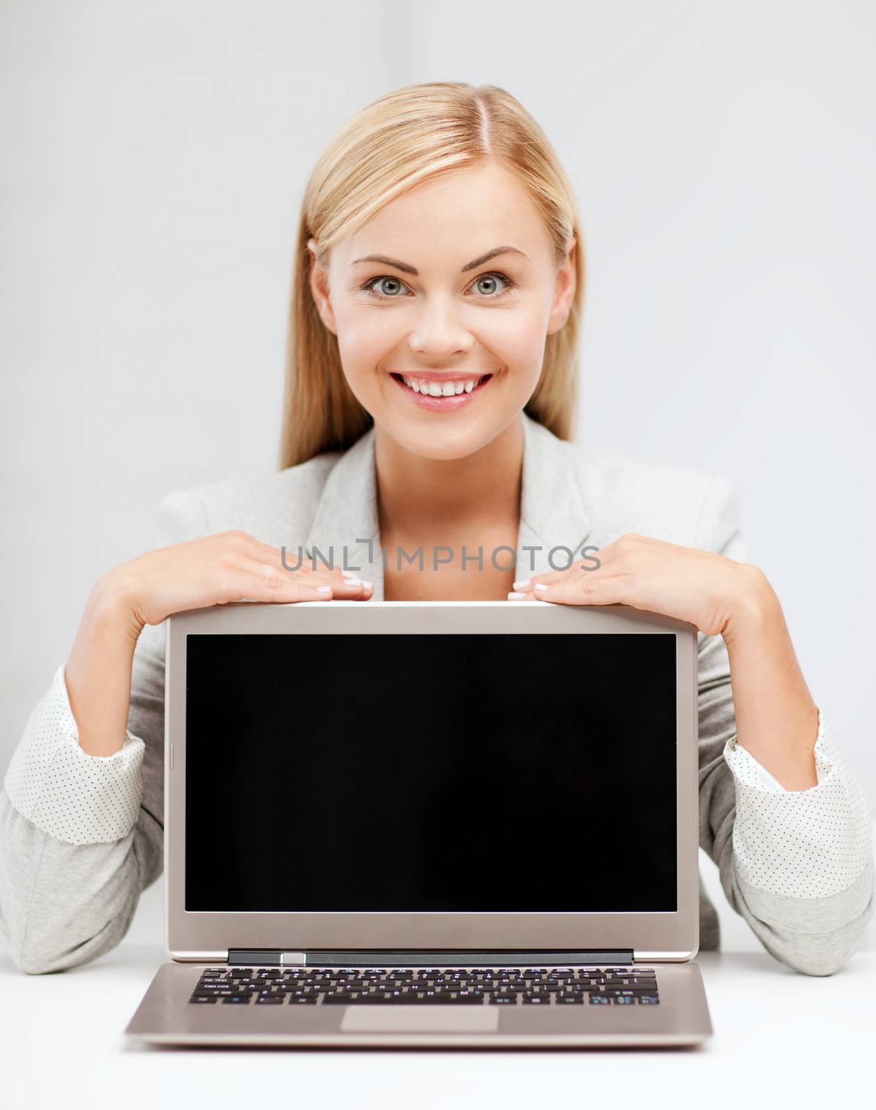 education,business, technology and internet concept - smiling woman with laptop pc