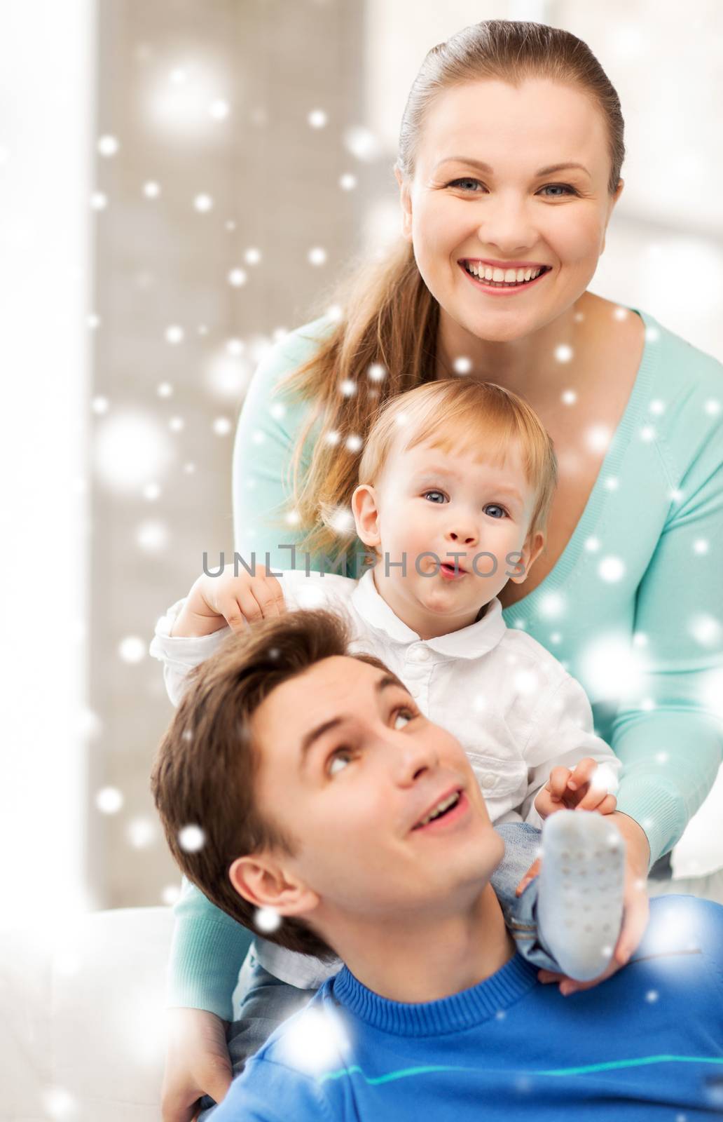 family, children, christmas, x-mas, love concept - happy parents playing with adorable baby