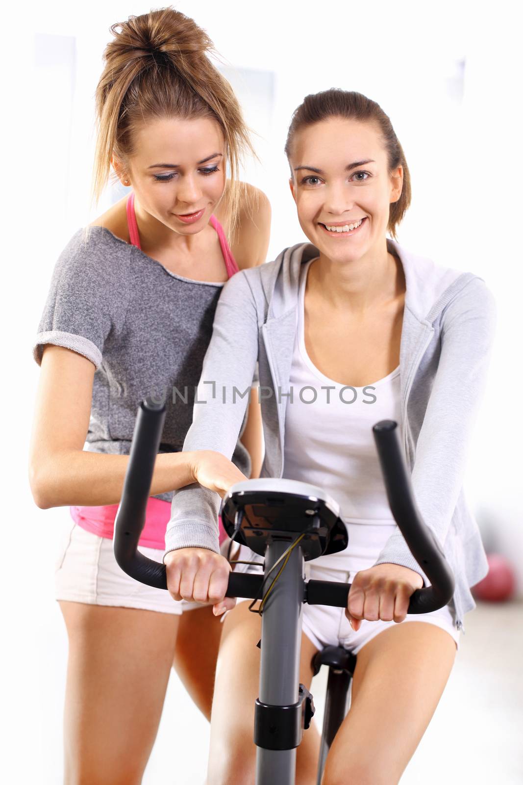 Beautiful, young, slim, athletic woman during a workout at the gym