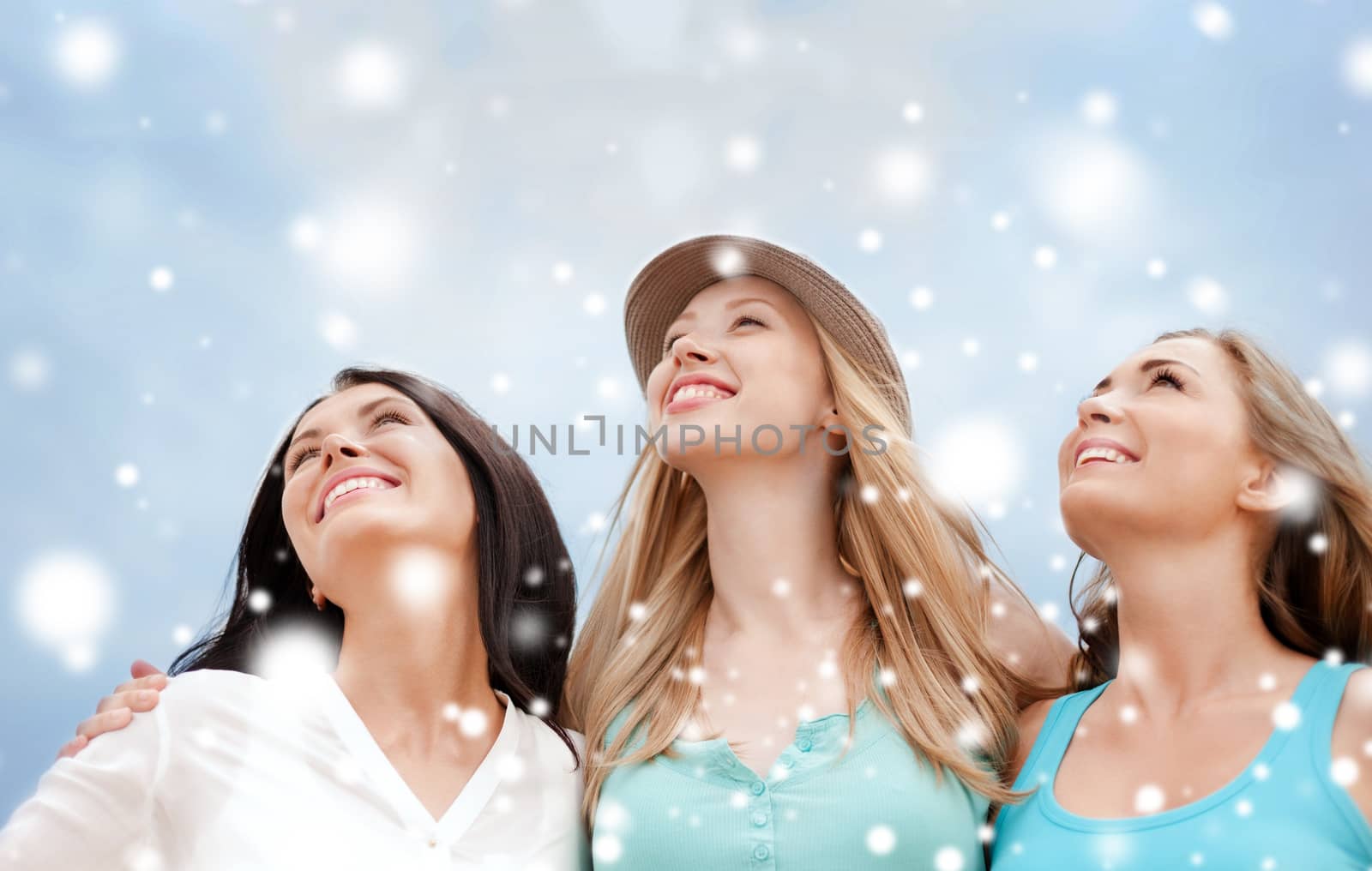 summer holidays and vacation concept - girls looking up in the sky