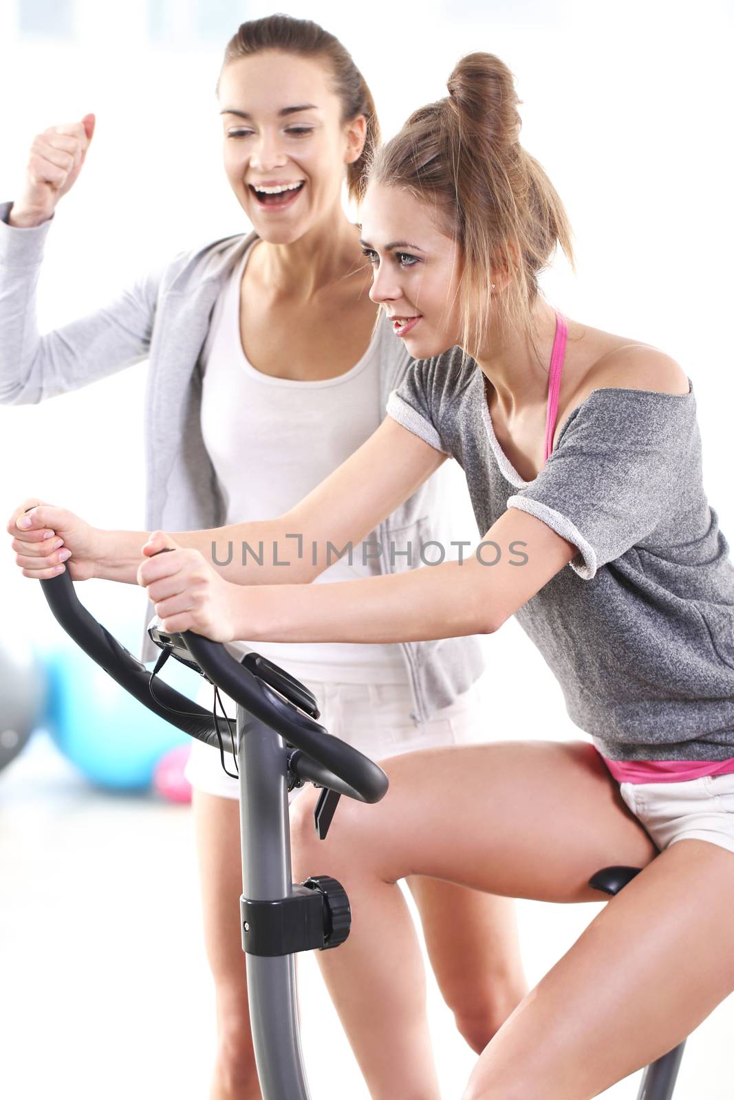 Beautiful, young, slim, athletic woman during a workout at the gym