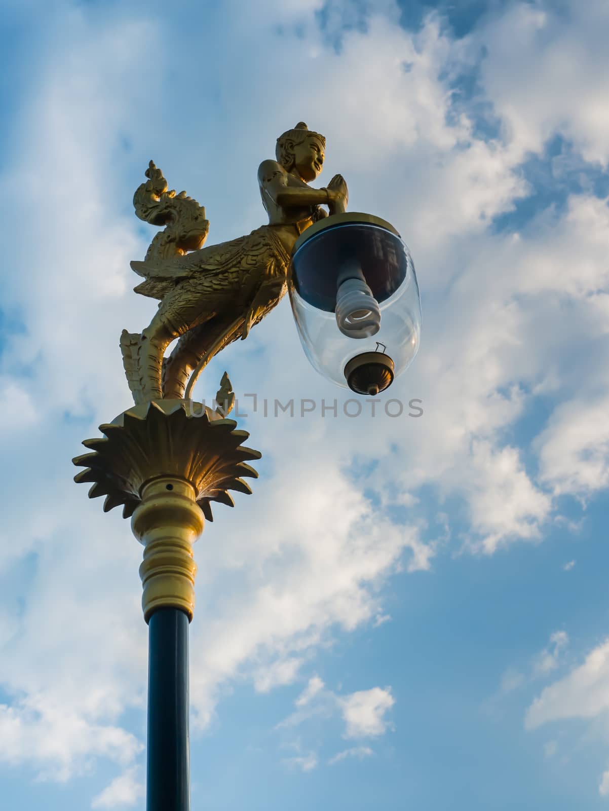 Beautiful lamp under blue sky by golengstock