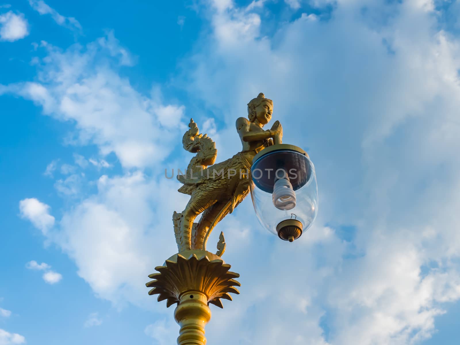 Beautiful lamp under blue sky by golengstock