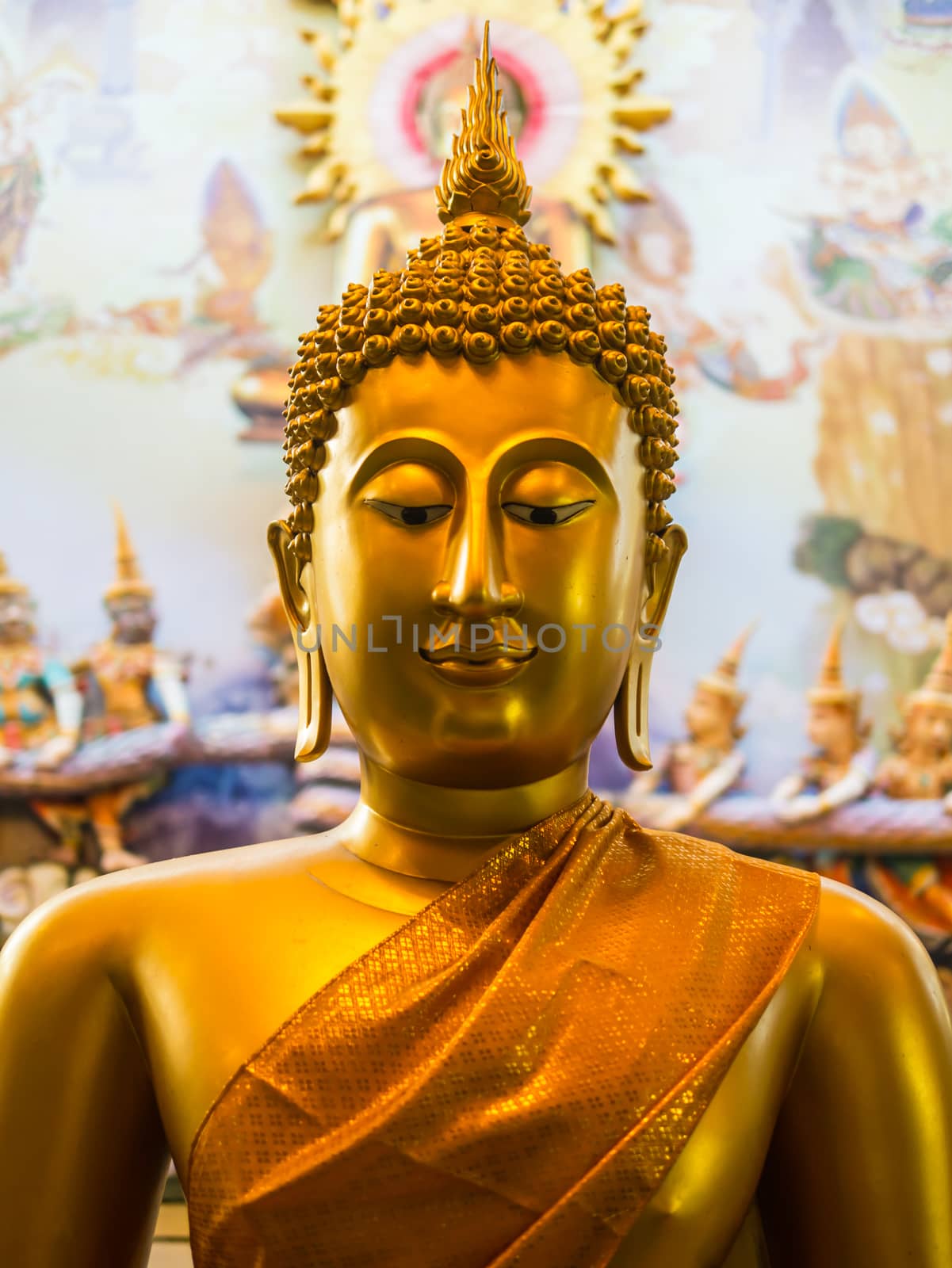 Buddha statues are a beautiful golden color by golengstock