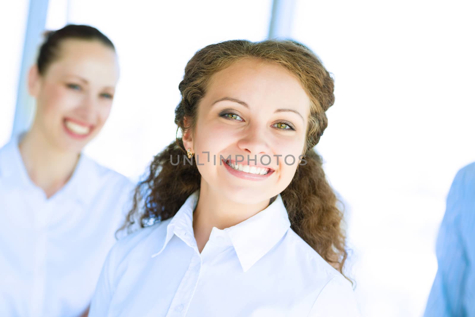 happy business woman standing next to their counterparts outside the flipchart achievements in business