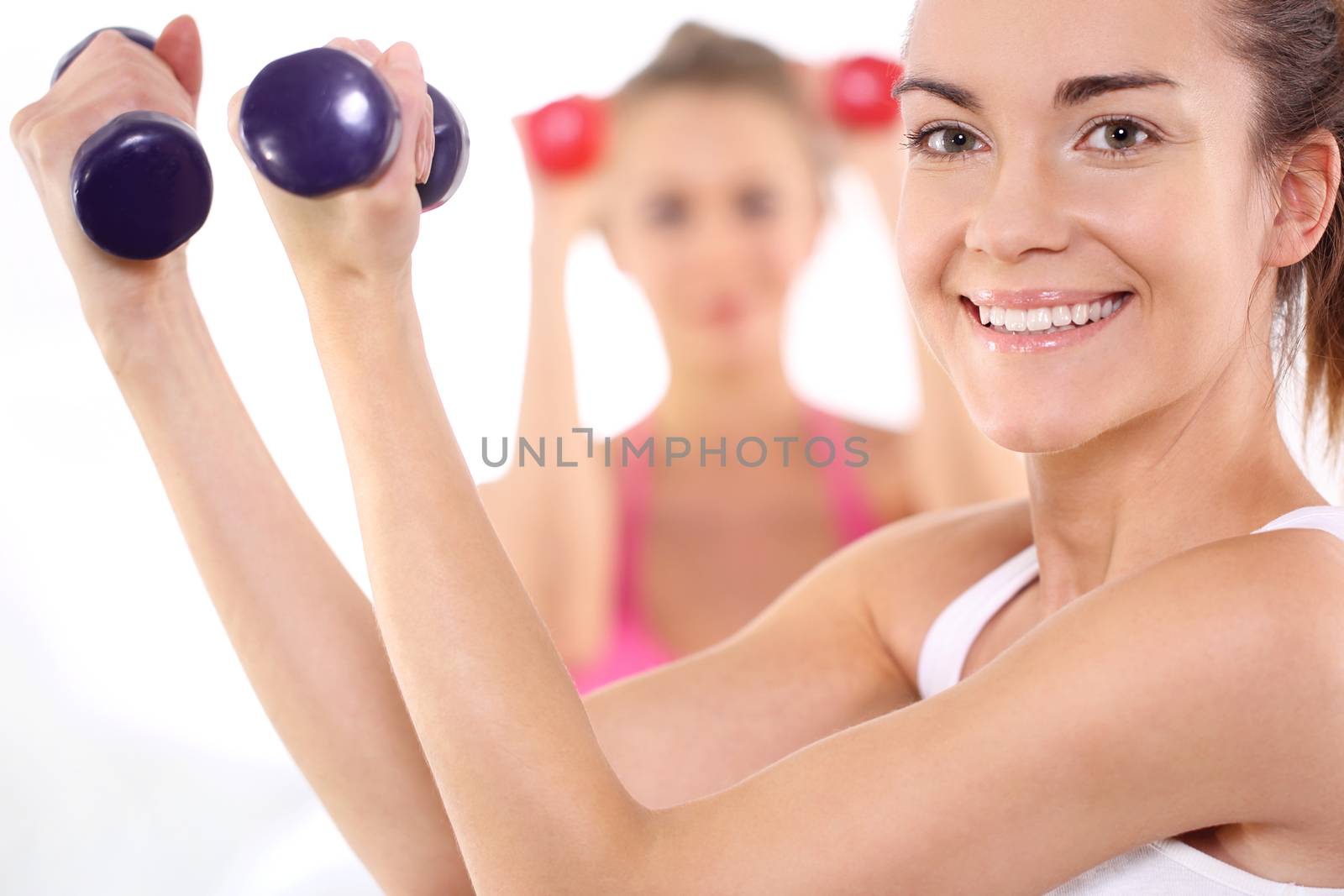 Beautiful women train with weights