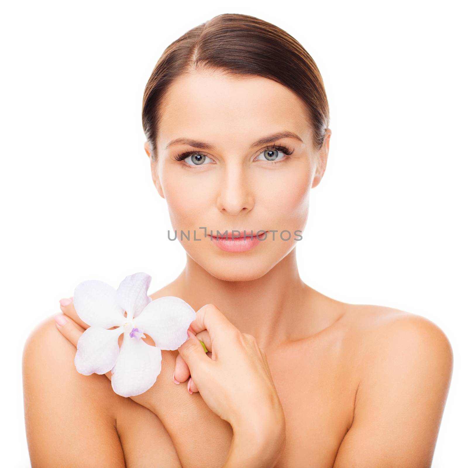 health and beauty concept - relaxed woman with orhid flower
