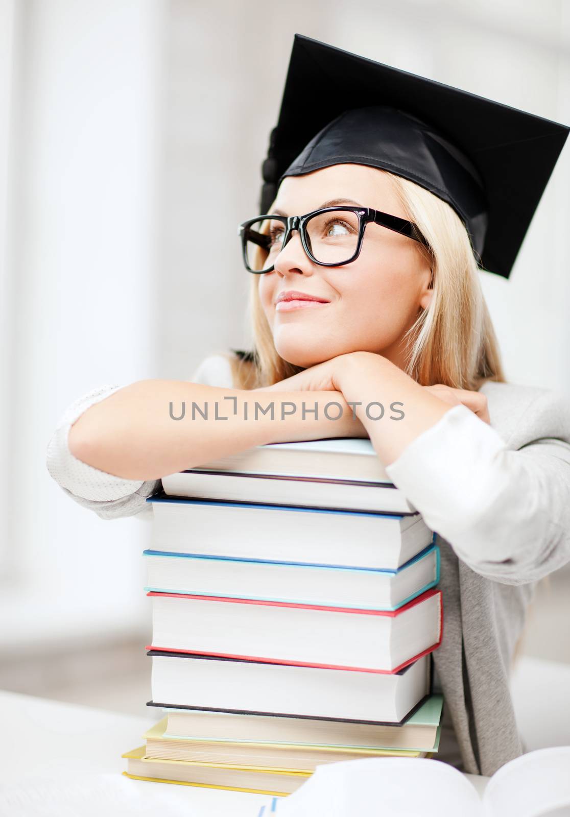 student in graduation cap by dolgachov