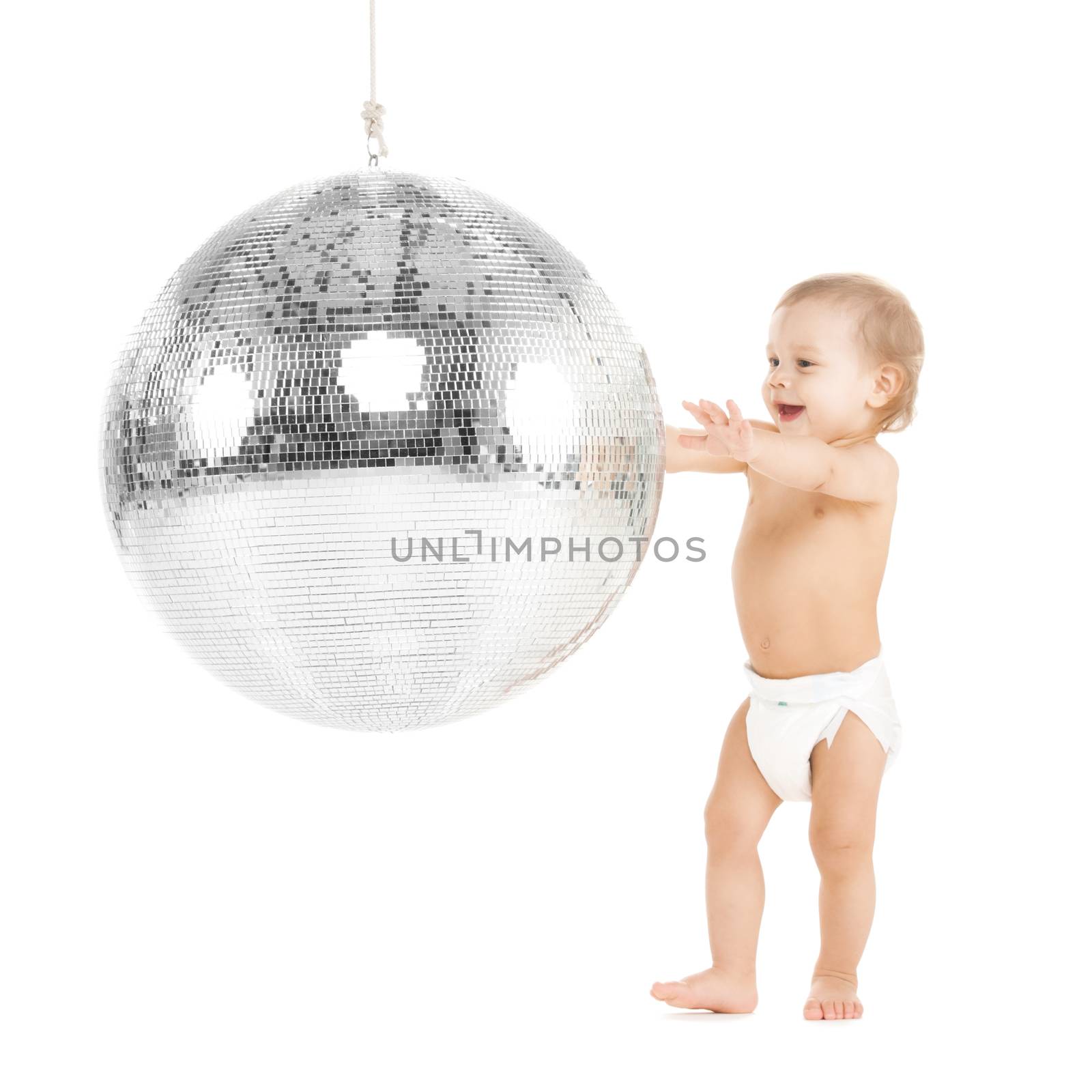 toddler playing with disco ball by dolgachov
