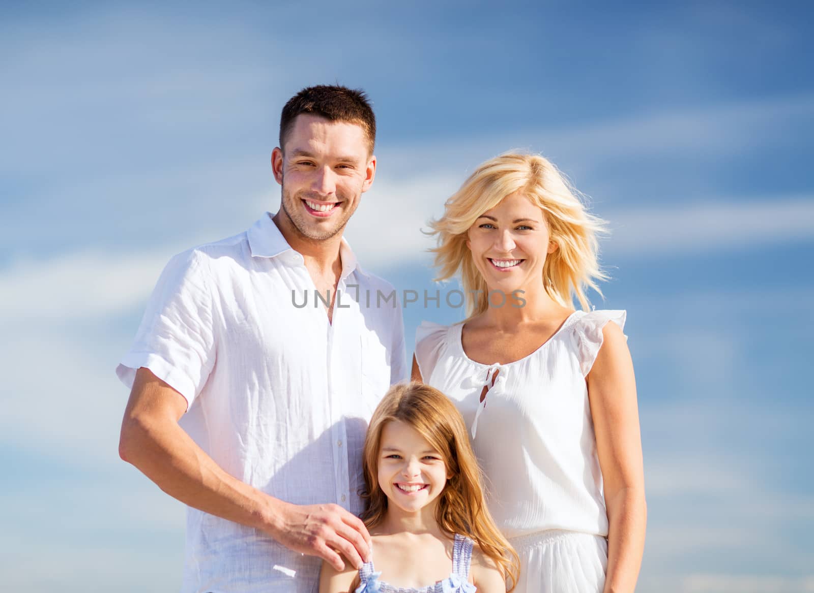 summer holidays, children and people concept - happy family with blue sky