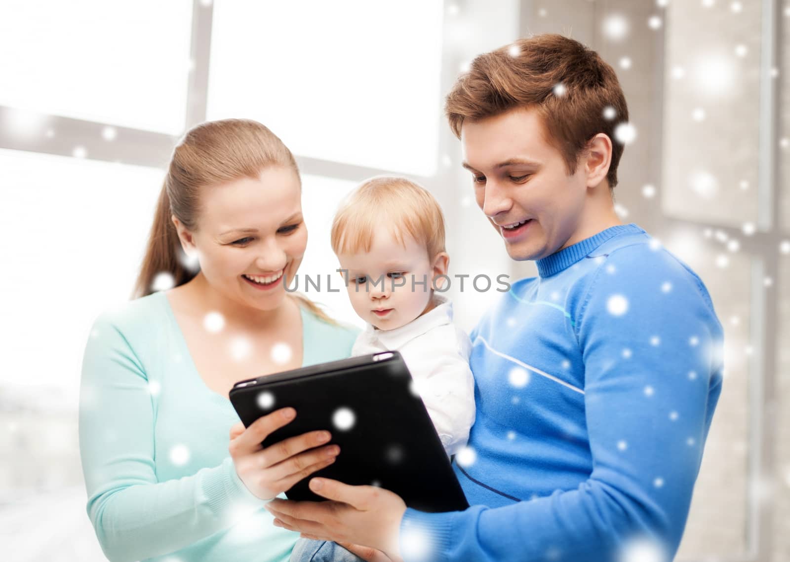 family, children, christmas, x-mas, love, technology concept - happy parents and adorable baby with tablet pc