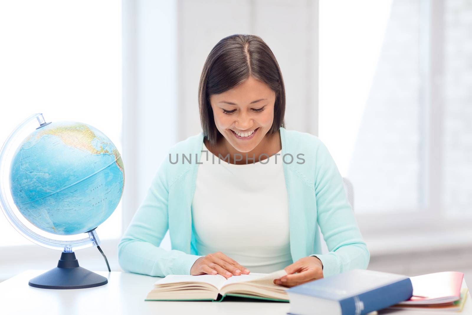 education and school, travel concept - female teacher with globe and book