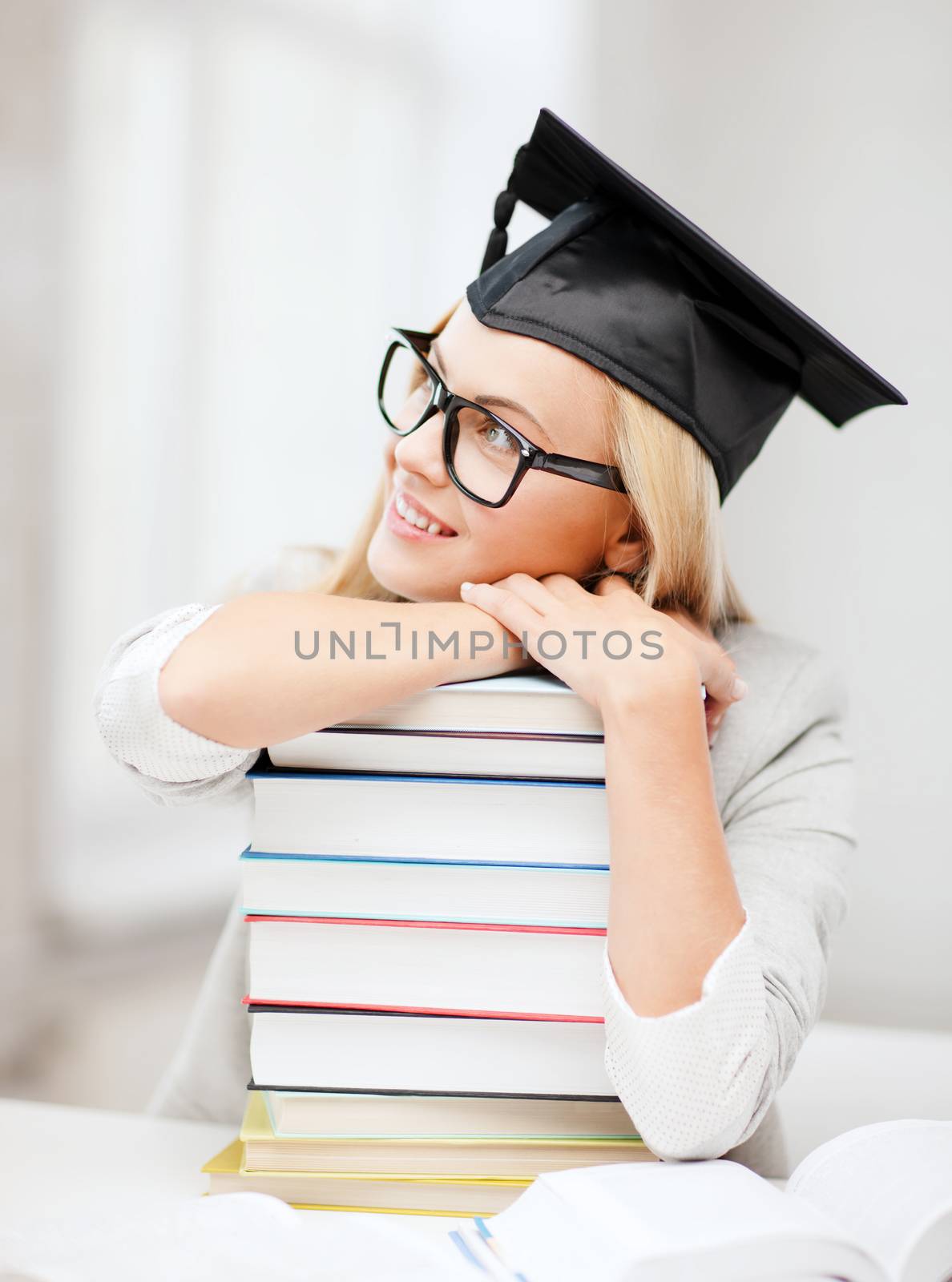 student in graduation cap by dolgachov