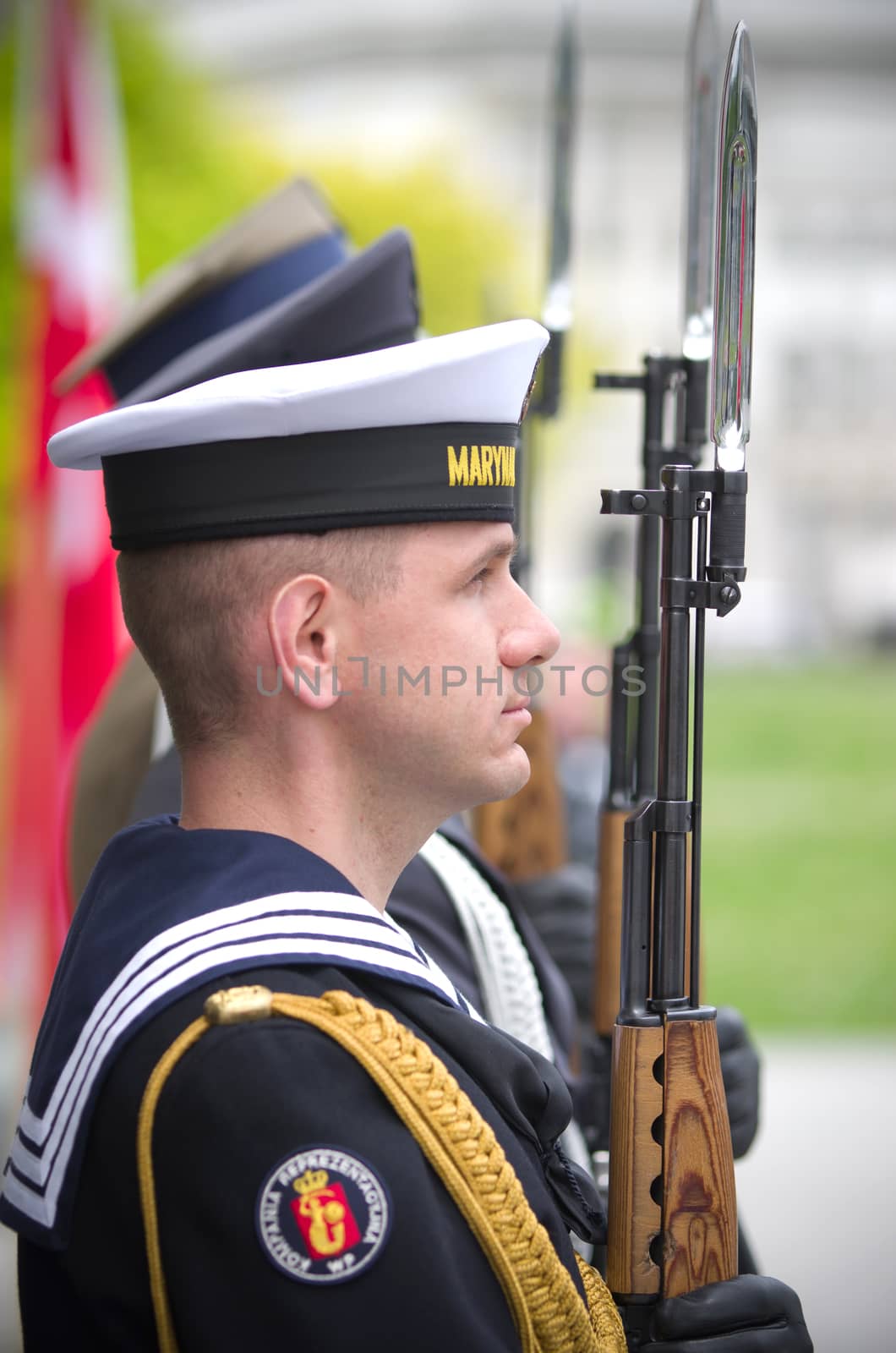 Warsaw, Poland – May 12, 2014: Honor guard at the Tomb of the Unknown Soldier. The monument  is the most important element of the Pilsudski Square, was built-up in a preserved colonnade of the Saxon Palace which was destroyed during the WW II.