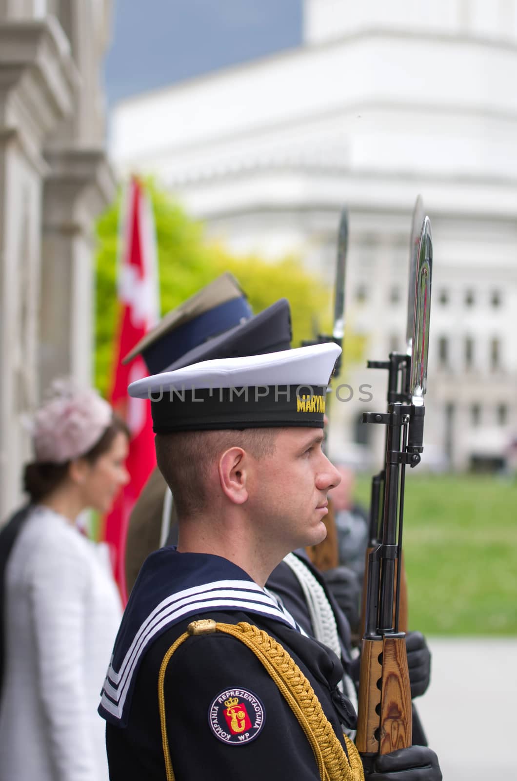 Warsaw, Poland – May 12, 2014: Honor guard at the Tomb of the Unknown Soldier. The monument  is the most important element of the Pilsudski Square and was built-up in a preserved colonnade of the Saxon Palace which was destroyed during the WW II.