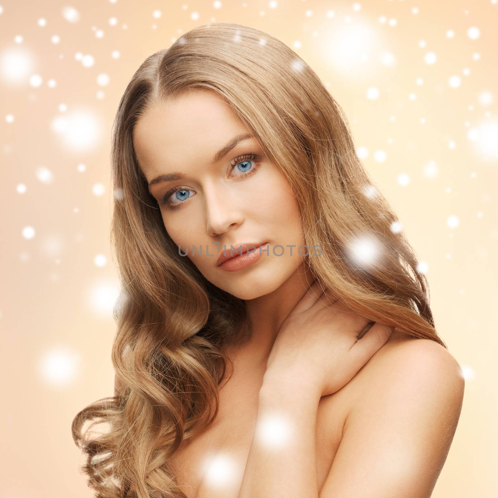 health and beauty concept - face of beautiful woman with long hair