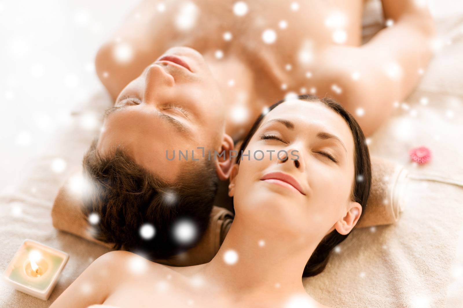 couple in spa salon lying on the massage desks by dolgachov