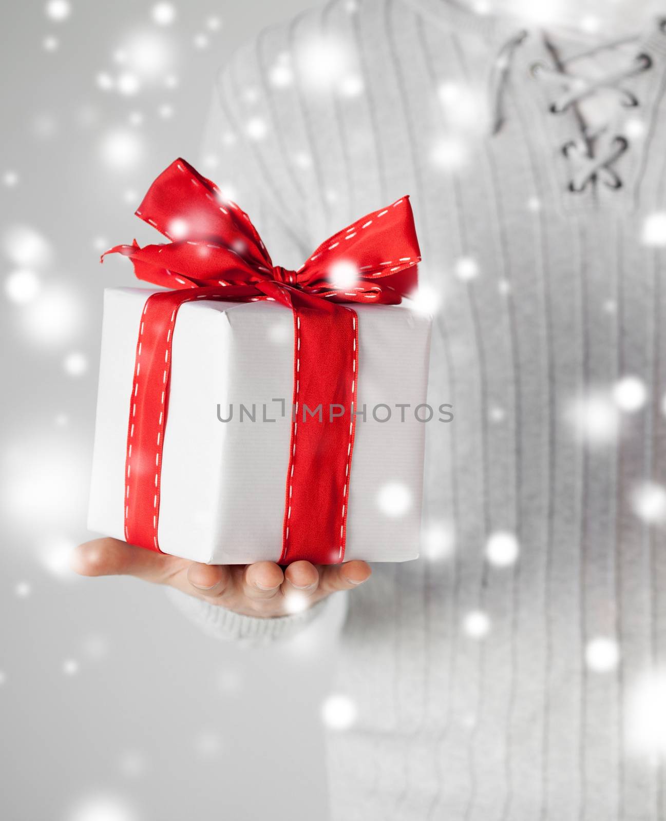 valentine's day, christmas, x-mas, winter, happiness concept - man holding a gift box