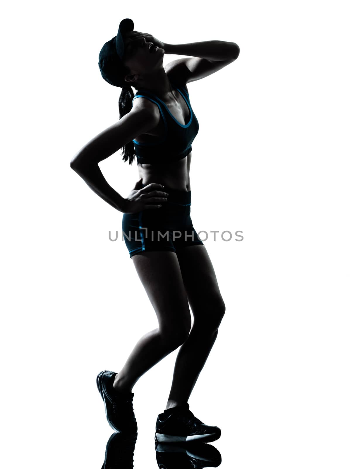 one  woman runner jogger tired breathless in silhouette studio isolated on white background