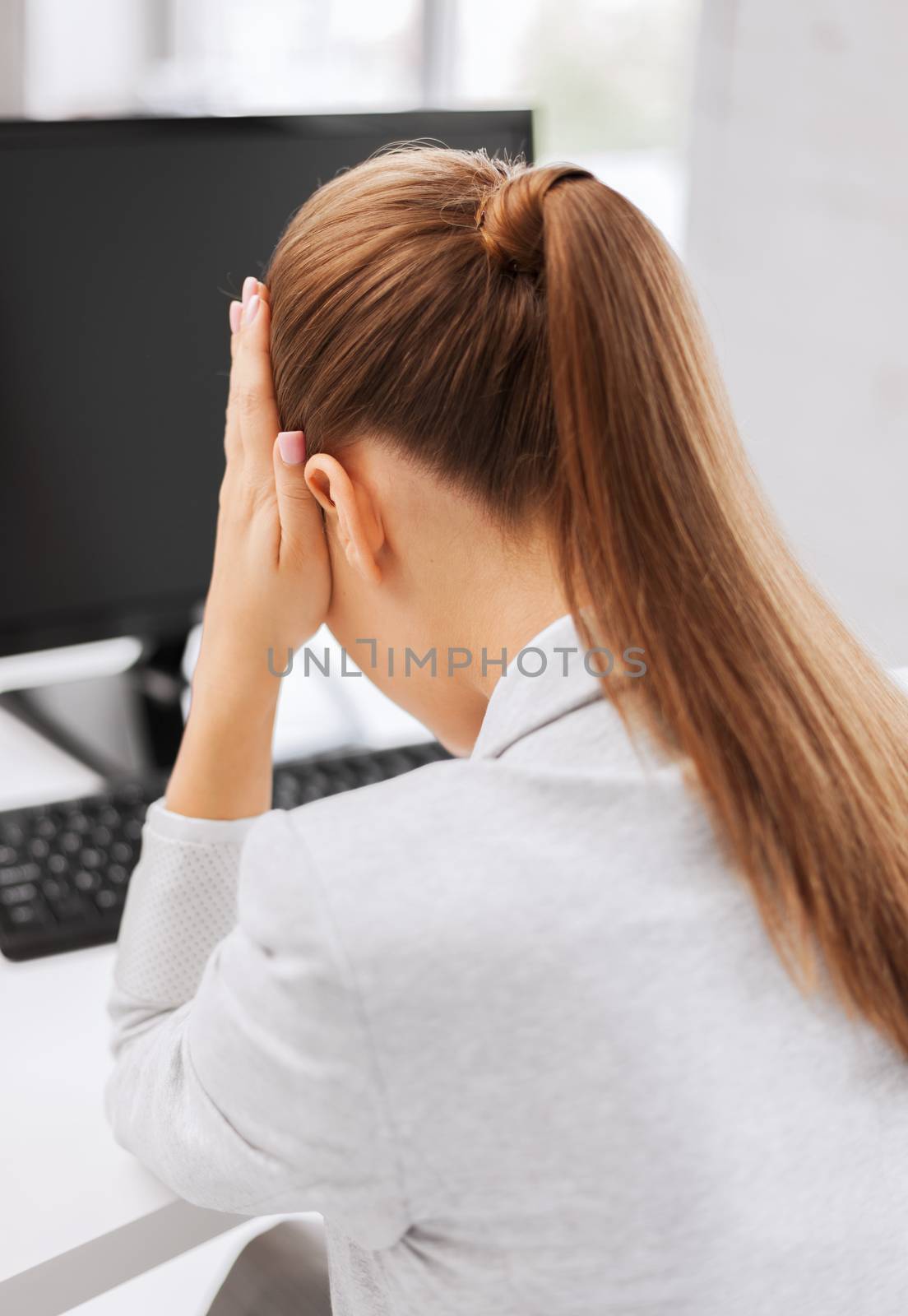stressed woman with computer by dolgachov