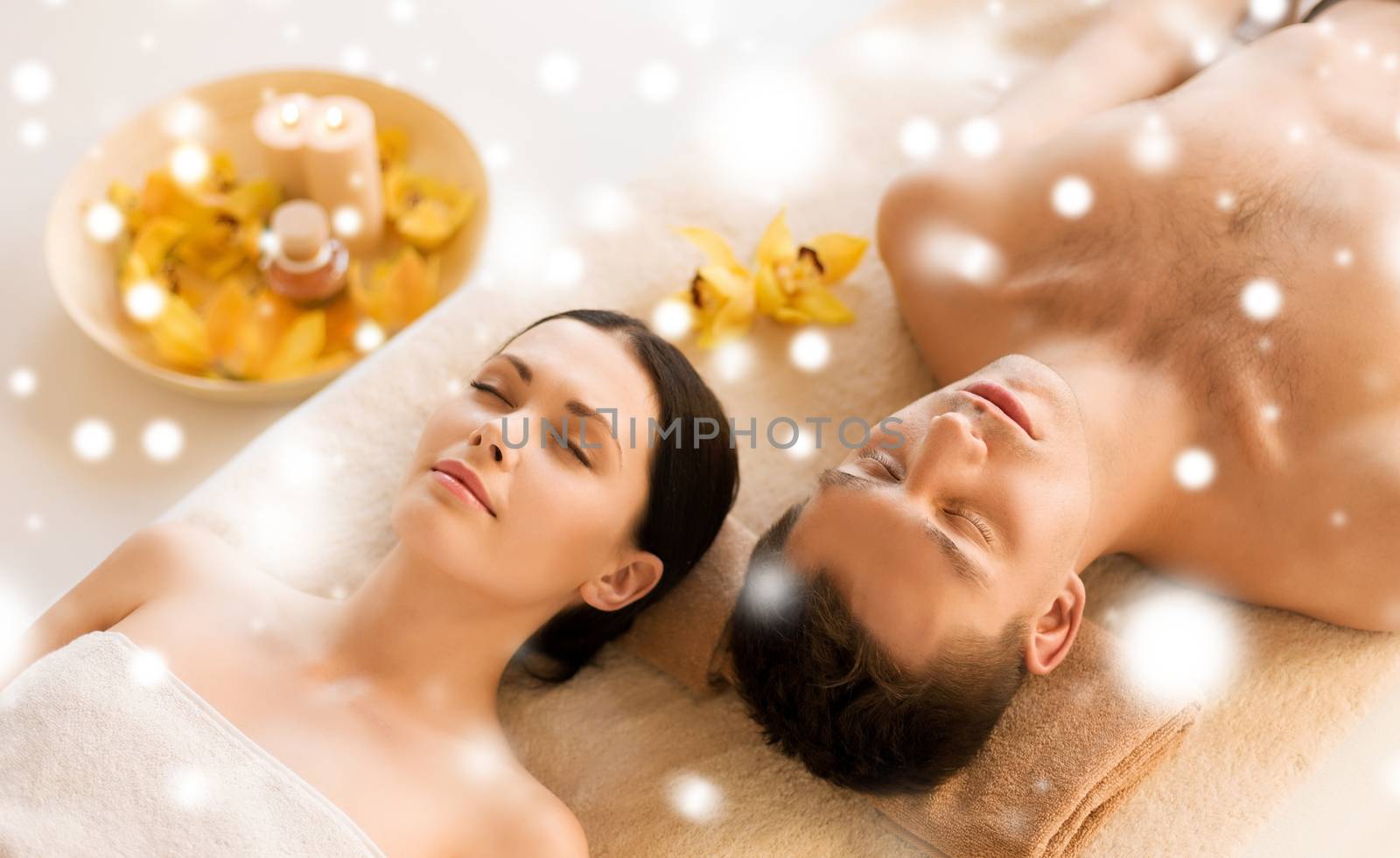 couple in spa salon lying on the massage desks by dolgachov