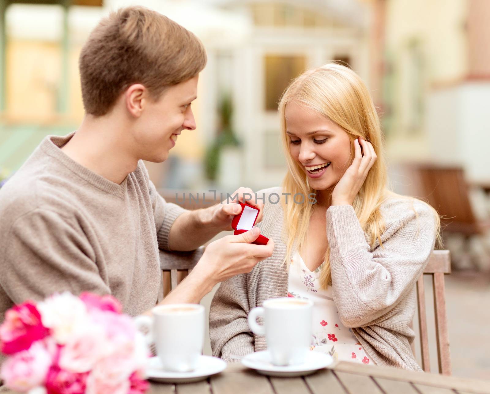 romantic man proposing to beautiful woman by dolgachov