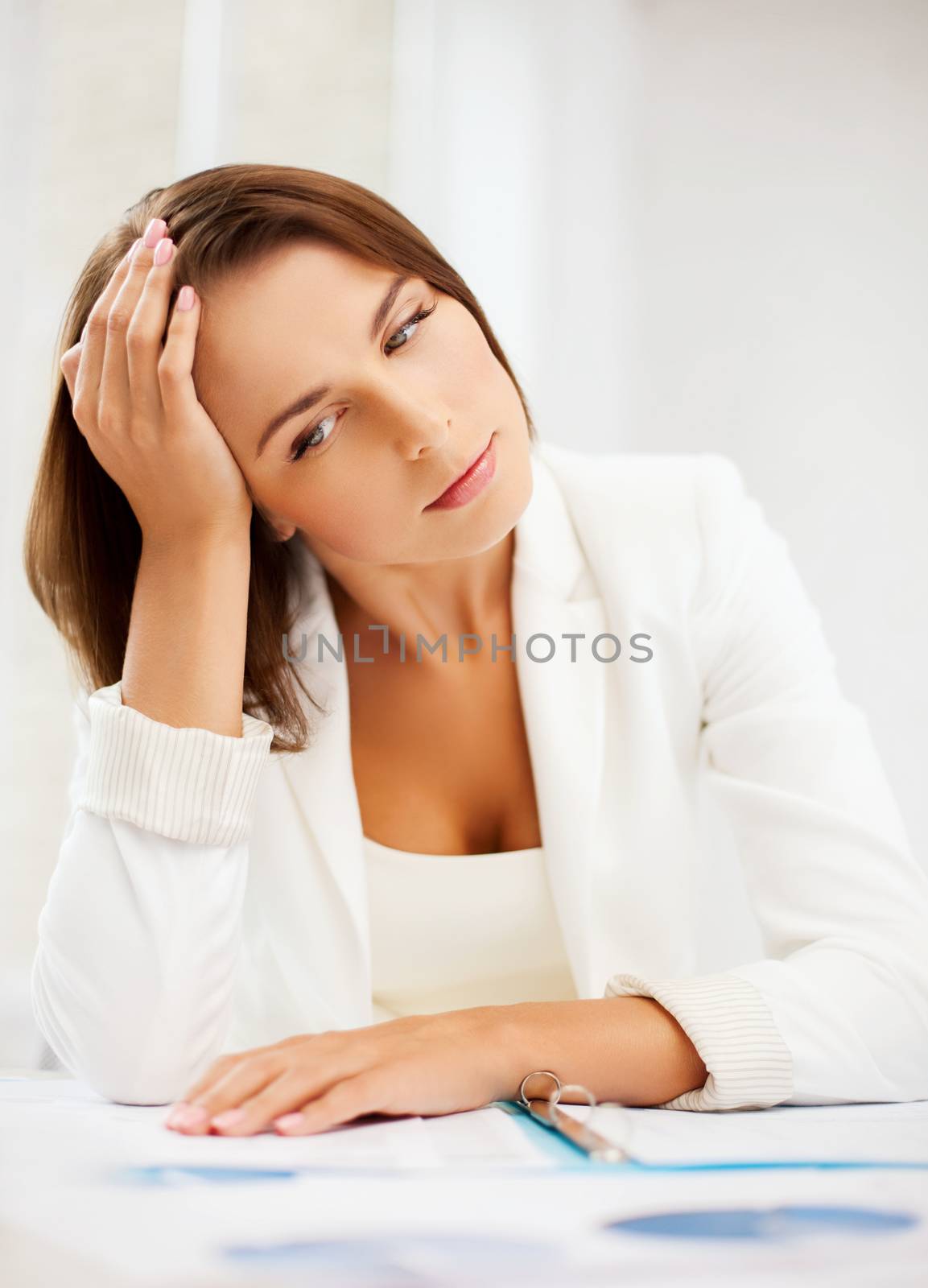 business and education concept - bored and tired woman with documents