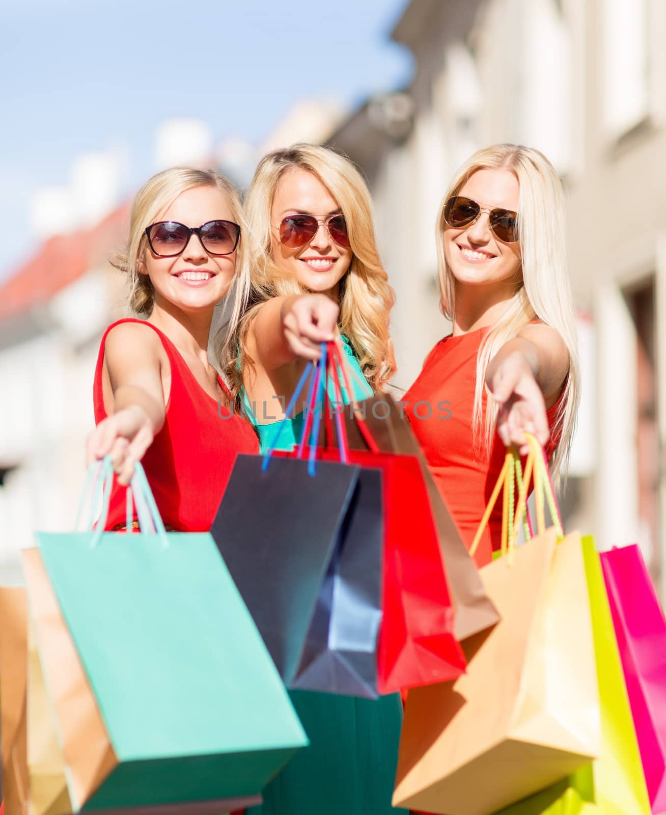beautiful women with shopping bags in the ctiy by dolgachov