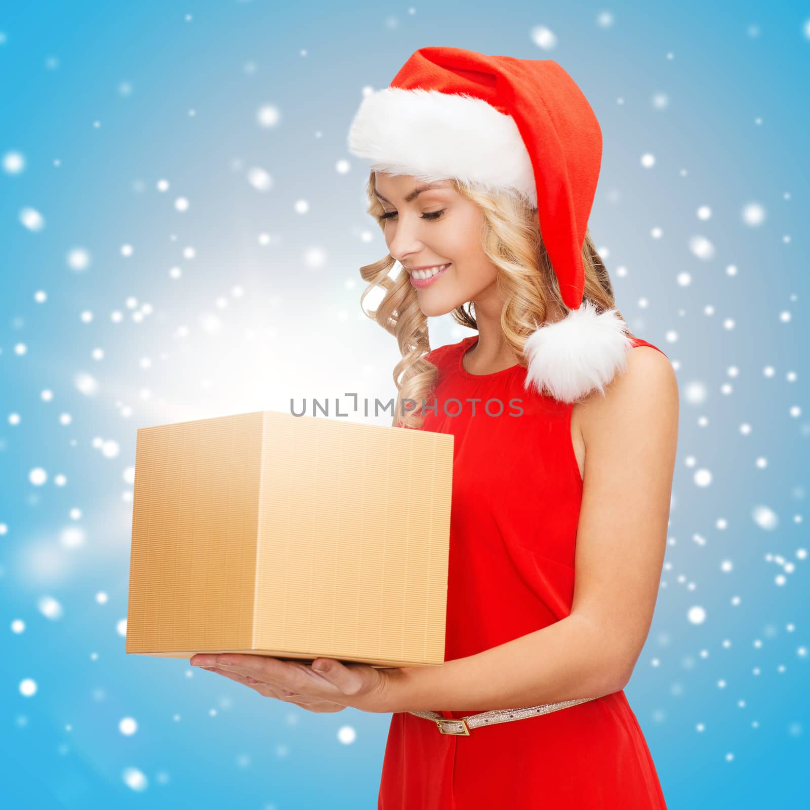 christmas, x-mas, new year, winter, happiness concept - smiling woman in santa helper hat with magic gift box