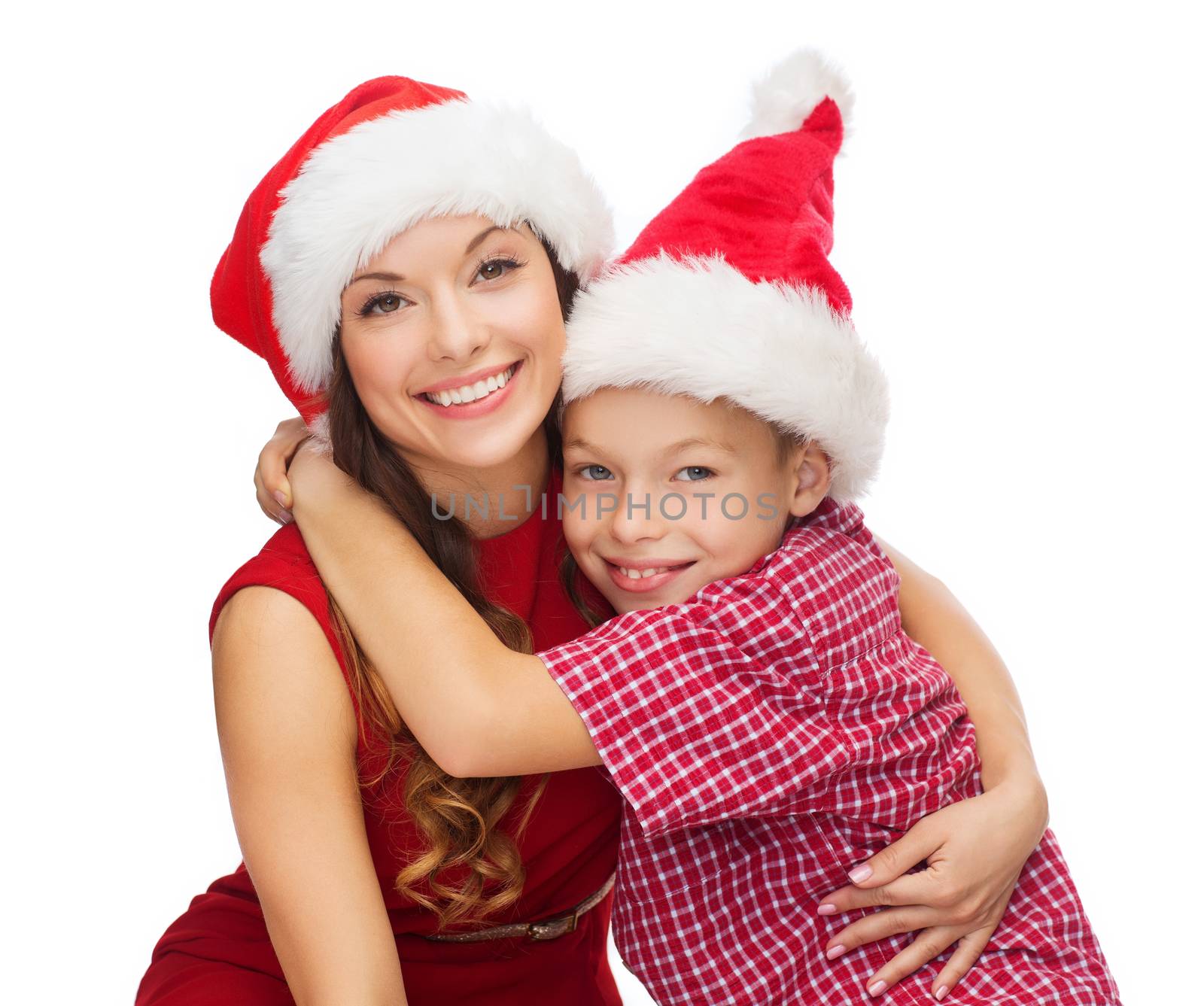 holidays, presents, christmas, x-mas concept - happy mother and child boy in santa helper hats