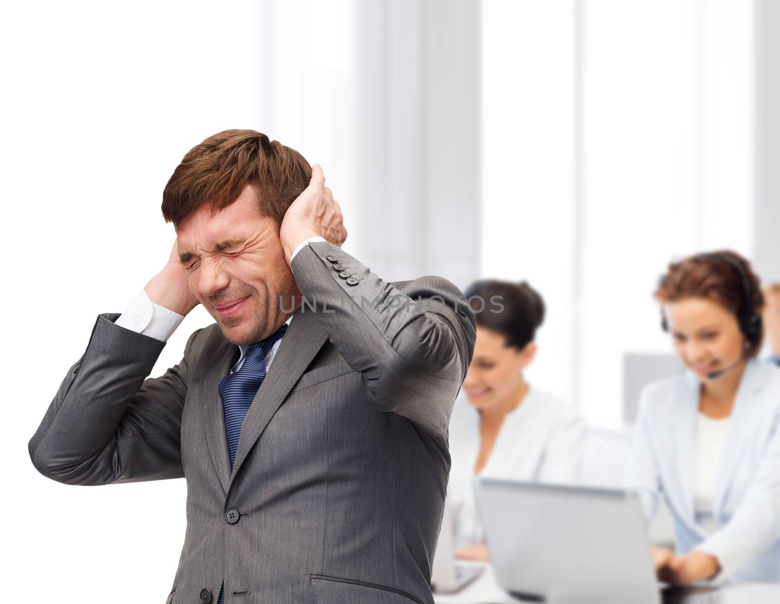 business and office, stress, problem, crisis, loud noise concept - stressed buisnessman or teacher closing ears