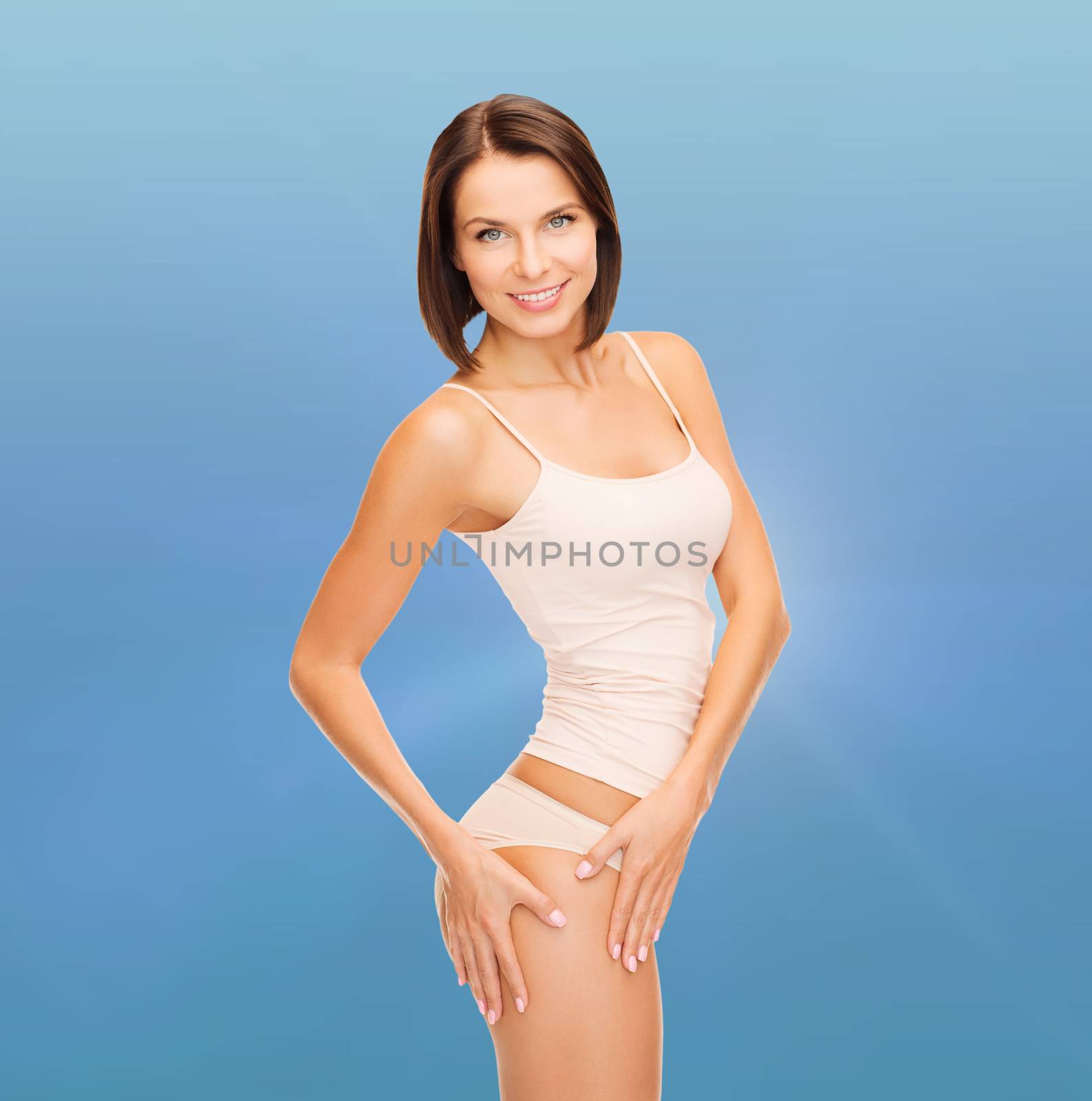 health and beauty - woman in cotton underwear showing slimming concept