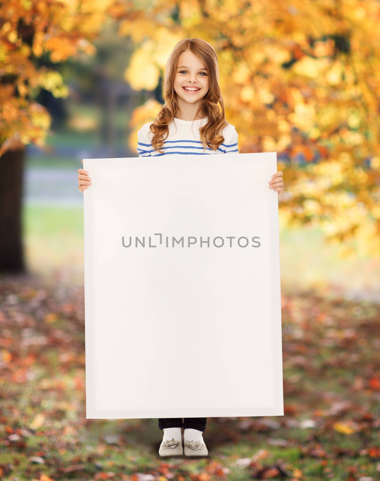 education and blank board concept - little girl with blank white board