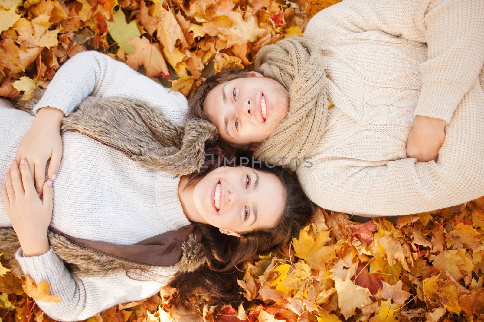 holidays, love, travel, tourism, relationship and dating concept - romantic couple in the autumn park