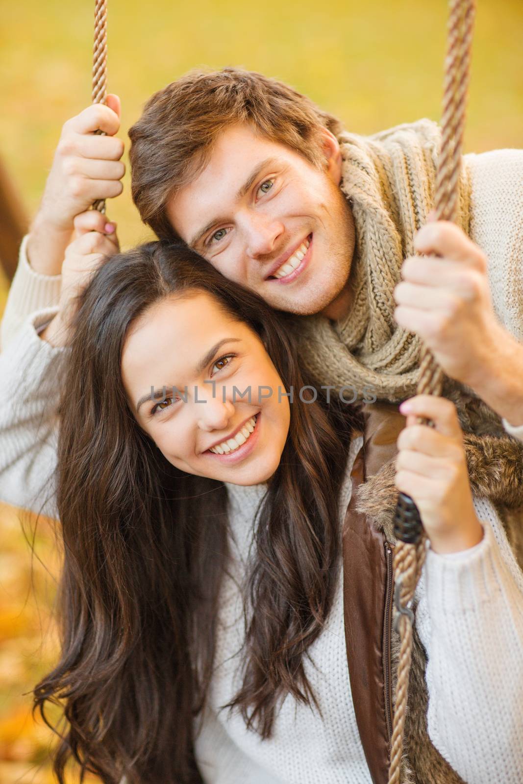 romantic couple in the autumn park by dolgachov