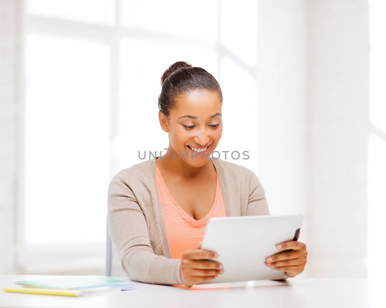 business and education concept - smiling student girl with tablet pc